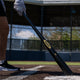 Player at bat with the Baum Bat Standard Gold Stock Maple Baseball Bat