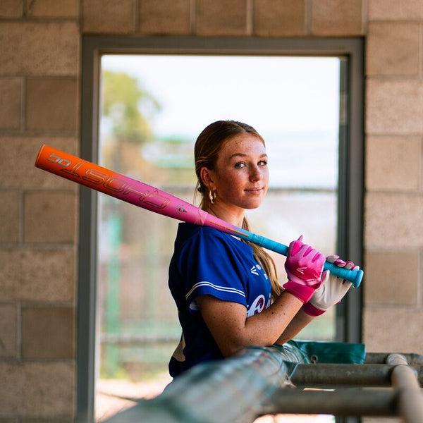 Player modeling the 2025 Easton Ghost OG Rainbow Sherbert Fastpitch Bat
