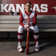 Arkansas' Bri Ellis sitting in the dugout with the 2026 Easton Ghost® Advanced Fastpitch Bat