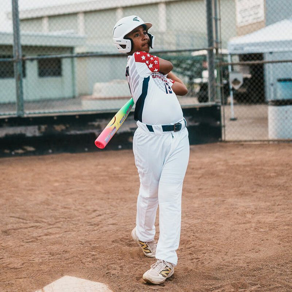 Young player batting with the 2026 Easton Hype Fire® USA Baseball Bat