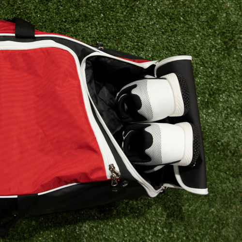 Close-up of shoe compartment on the Marucci Stockade Wheeled Duffel Bag