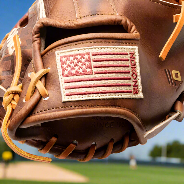 Close-up of the Nokona U.S. Flag logo on the Nokona Walnut Edge™ Precision 33.5" Baseball Catchers Mitt