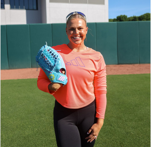 Fastpitch star Amanda Lorenz holding the Marucci Nightshift Series Lorenz Fastpitch and Baseball Glove