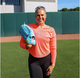 Fastpitch star Amanda Lorenz holding the Marucci Nightshift Series Lorenz Fastpitch and Baseball Glove