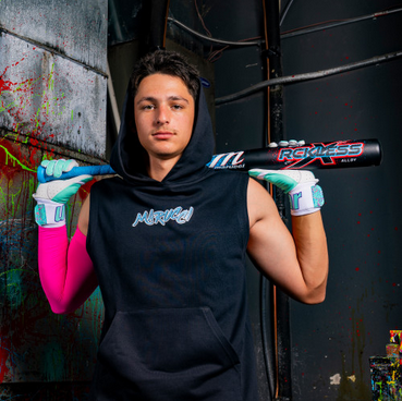 Player posing with the 2026 Marucci CATX RCKLESS -3 BBCOR Baseball Bat