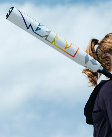 Player holding the 2025 DeMarini Prism Plus+ -11 Fastpitch Bat over her shoulder