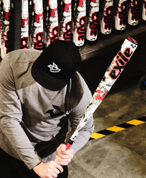 Young player testing the feel on the 2026 DeMarini Exile™ Baseball Bat