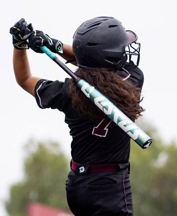 Athlete swinging the 2026 DeMarini Lotus Fastpitch Bat