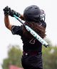 Athlete swinging the 2026 DeMarini Lotus Fastpitch Bat