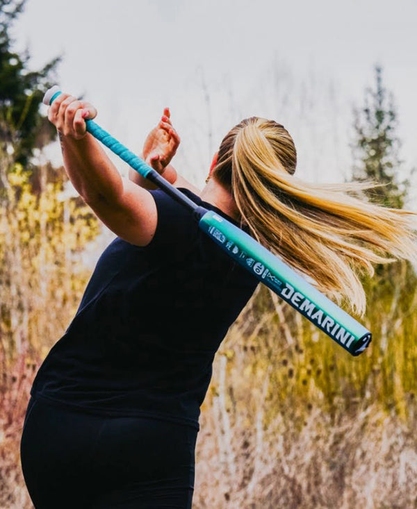 Athlete swinging the 2026 DeMarini Lotus Fastpitch Bat