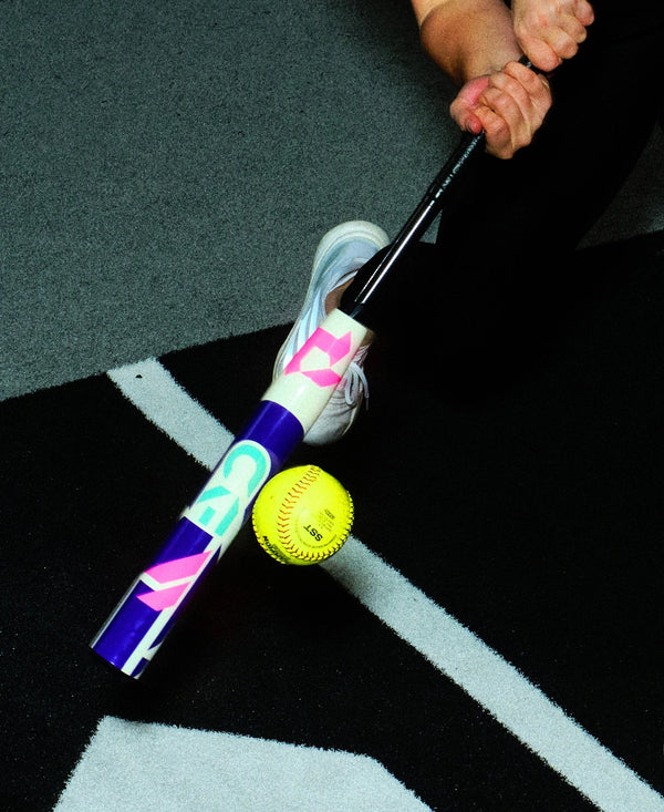 Close-up of a player hitting with a 2026 DeMarini CF® FE Fastpitch Bat