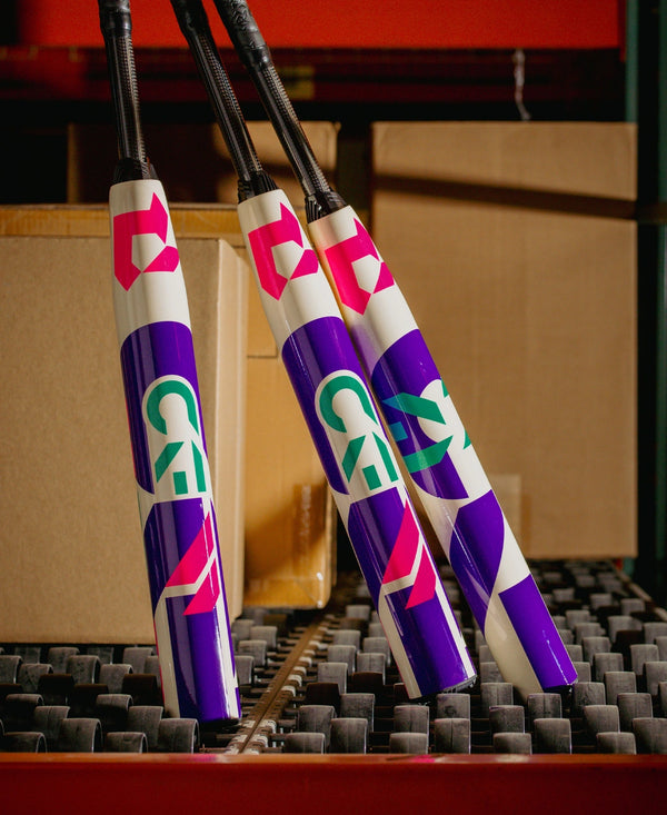 2026 DeMarini CF® FE Fastpitch Bats in a storage area