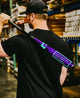 Man carrying the 2026 DeMarini The Goods™ Royal Purple -3 BBCOR Baseball Bat through the DeMarini warehouse