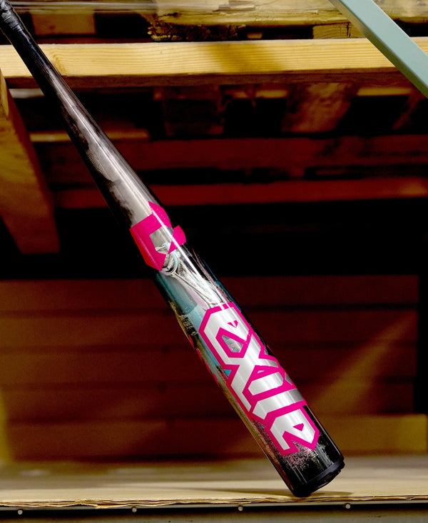 2026 DeMarini Exile™ Cyborg -3 BBCOR Baseball Bat leaning against a wooden surface