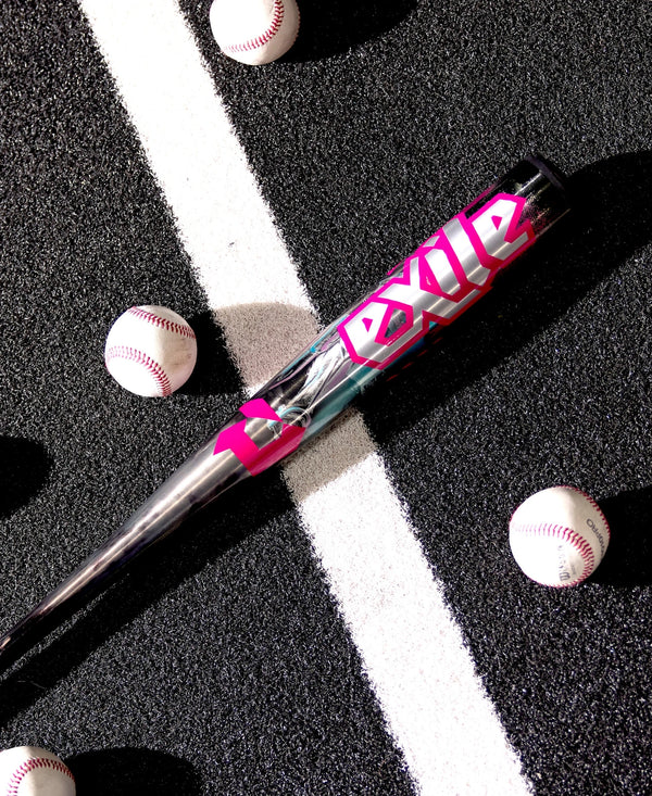 2026 DeMarini Exile™ Cyborg -3 BBCOR Baseball Bat laying on the ground by some baseballs