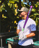 Player holding the 2025 Louisville Slugger Atlas™ Neon Energy -3 BBCOR Baseball Bat