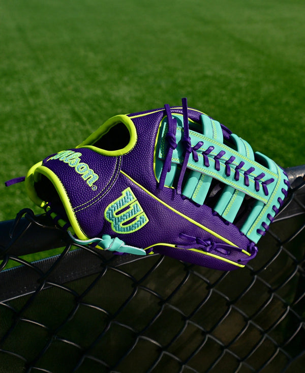 Wilson Fall 2025 A2000® 1810SS 12.75" Baseball Glove sitting on a fence