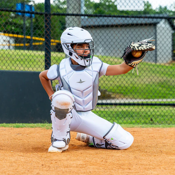 Young catcher receiving a pitched ball while wearing the All Star MVP-Pro Series™ Youth Catching Kit