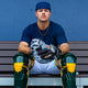 Player on the bench wearing the All Star Limited Pro Elite® Series 34" Baseball Catchers Mitt