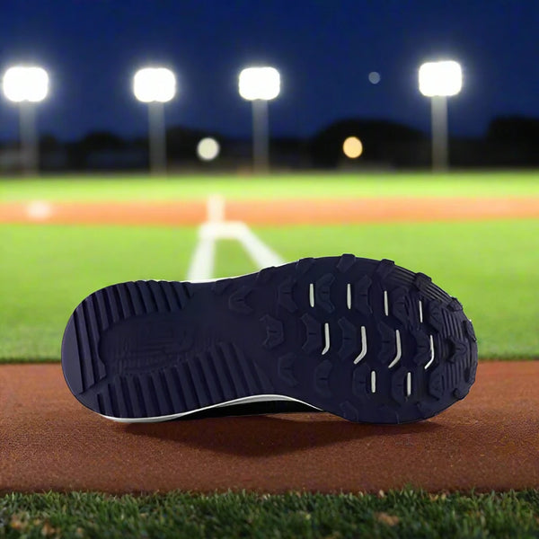 Sole of the New Balance Dynasoft 4040v7 Youth Turf Trainer - Navy