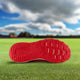 Sole of the New Balance Dynasoft 4040v7 Youth Turf Trainer - Red