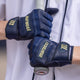 Player holding a bat whild wearing theMarucci Pittards® Reserve Adult Batting Glove