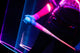Player holding the 2027 Easton Hype Fire® USA Baseball Bat with neon lighting