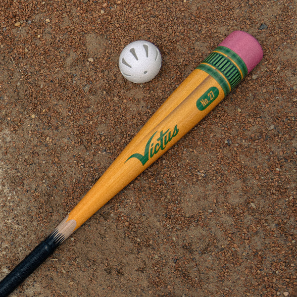 Close-up of the Victus Pencil Yardstick Plastic Bat and whiffle ball