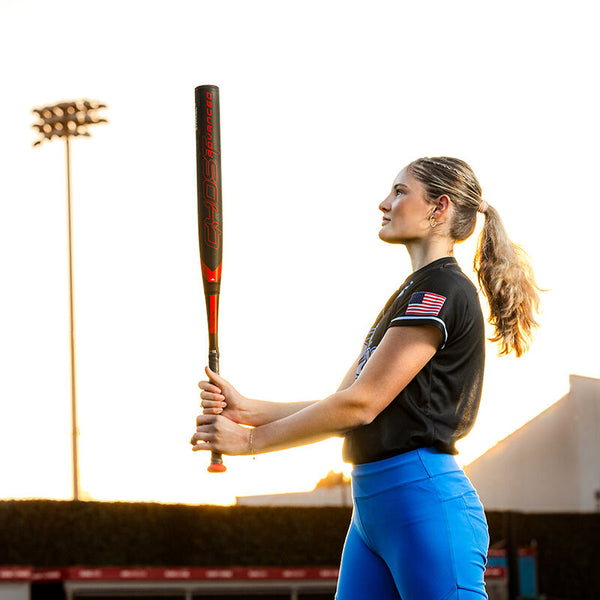 Player holding a 2024 Easton Ghost® Advanced -10 Fastpitch Bat