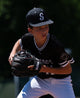 Young player in the field using the Wilson 2027 A1000® 1975 11.75" Baseball Glove