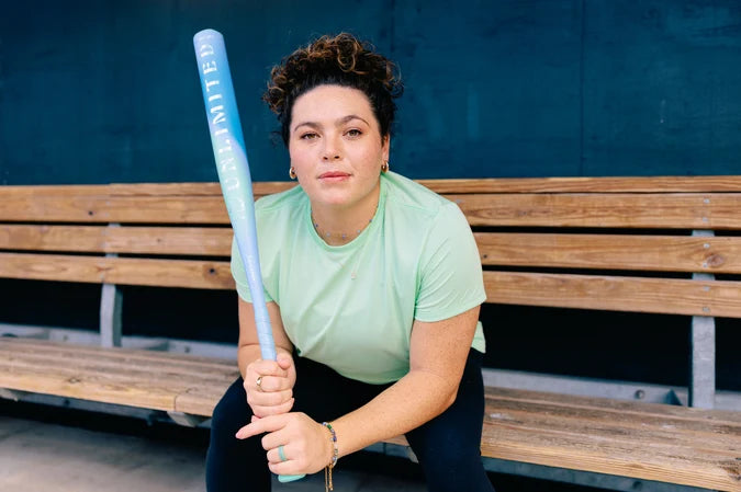 Elite fastpitch player holding the 2027 Easton Ghost Unlimited Era Wild One Fastpitch Bat