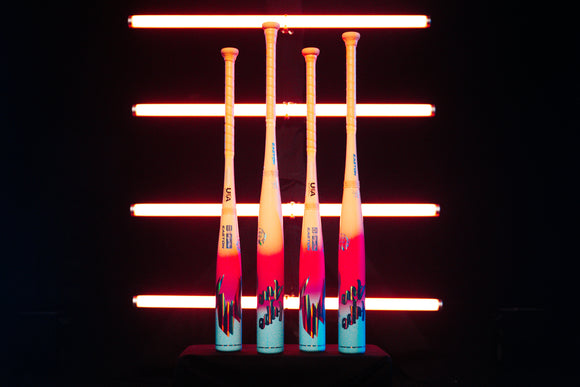 2027 Easton Hype Fire® USA Baseball Bats standing upright together in front of bright neon lights
