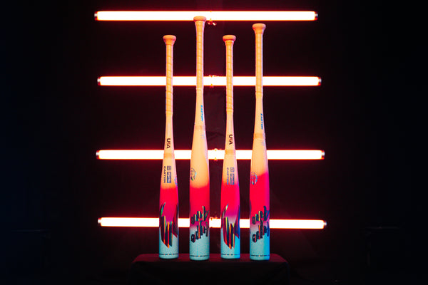 2027 Easton Hype Fire® USA Baseball Bats standing upright together in front of bright neon lights