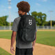 Player carrying the Under Armour Yard 2.0 Baseball Backpack