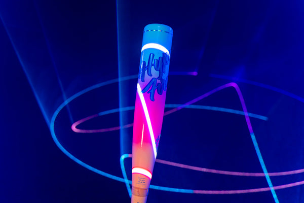 Close-up of the 2027 Easton Hype Fire® USA Baseball Bat in neon laser light