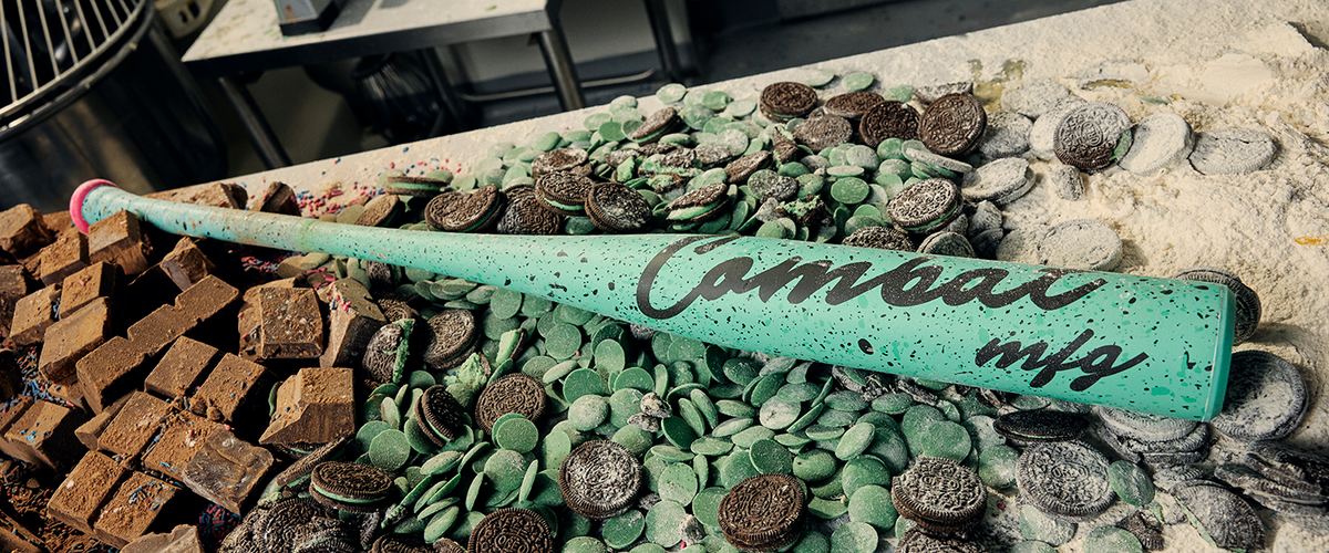 2026 Combat MFG Cookie Jar Mint Chip Spec-A1 -3 BBCOR Baseball Bat laying in a confectioners table