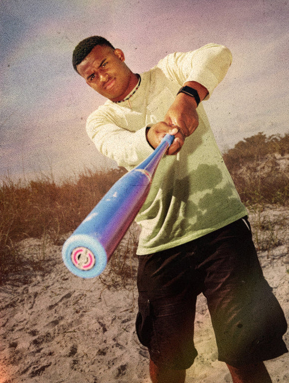 Player swinging the 2026 Combat MFG Spec A1 Coastal Mavericks -3 BBCOR Baseball Bat on the beach