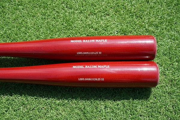Close-up of the barrel on the  Chandler RA13M Maple Wood Bat - Cherry/Cherry