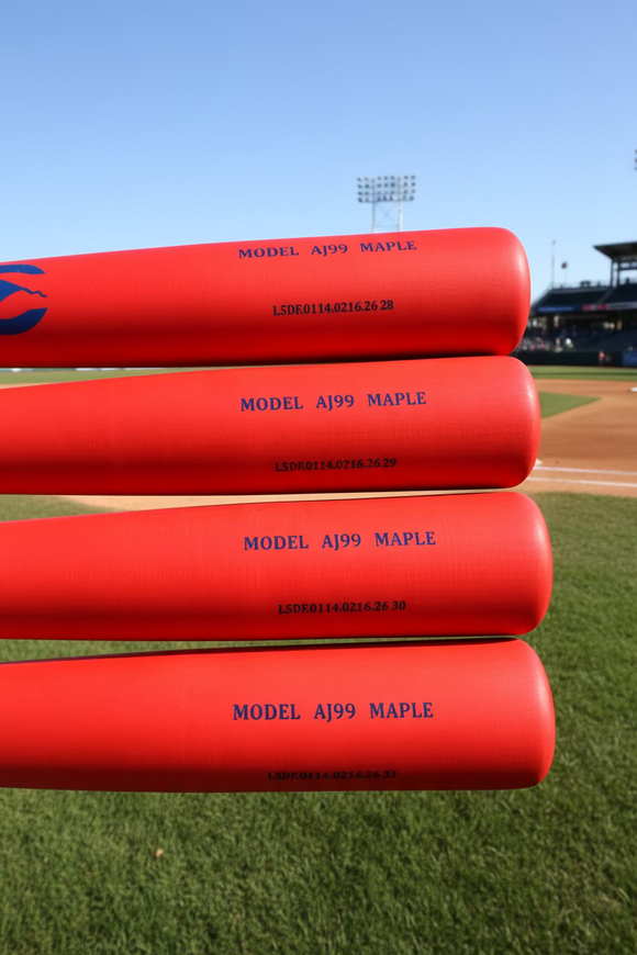 Close-up of the barrels of four Chandler AJ99 Maple Wood Bats - Midnight Blue/Red