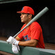 Player in the dugout holding the 2025 Easton Rope™ -3 BBCOR Baseball Bat