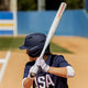 Side view of a premier fastpitch player up at bat using a 2025 Easton Ghost Unlimited Fastpitch Bat