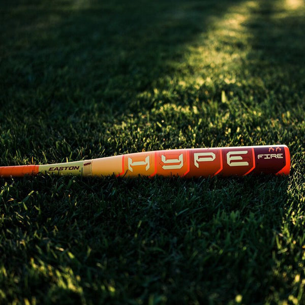 2025 Easton Hype Fire® USA Baseball Bat on the grass field