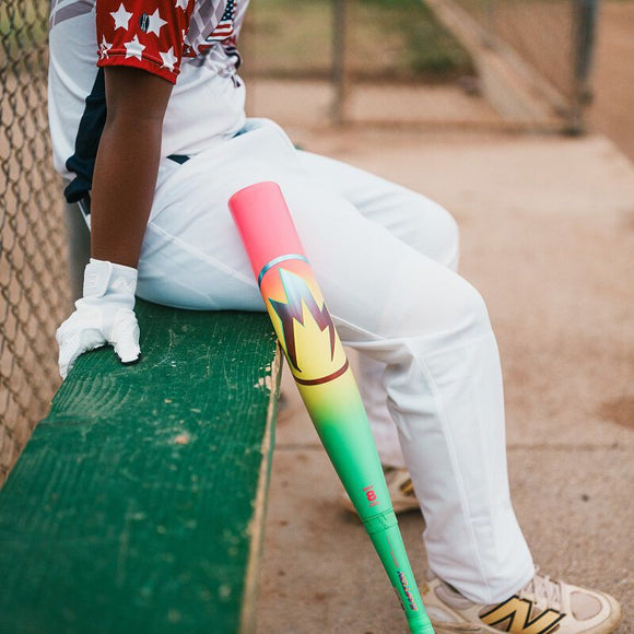 Young player on the bench waiting to hit with his 2026 Easton Hype Fire® USA Baseball Bat