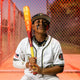 A young player holding the 2025 Easton Hype Fire® USSSA Baseball Bat