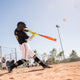 A young player hitting with a 2025 Easton Hype Fire® USSSA Baseball Bat