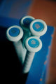 Close-up of the knobs of four 2027 Easton Ghost OG Fastpitch Bats