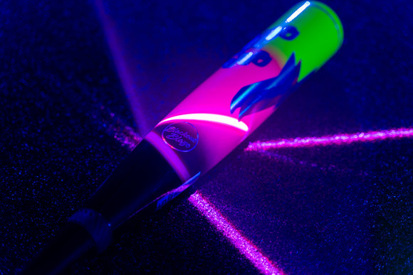Close-up of the 2027 Easton Hype Fire USSSA Baseball Bat illuminated with neon lighting