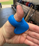 Close-up of a person wearing the ThumbPro Batter's Thumb Guard
