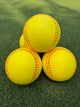 A stack of four Truflight Aceballz Pitching Machine Softballs
