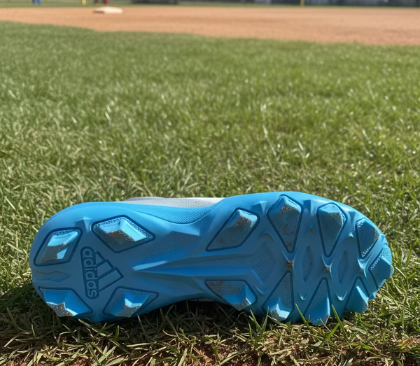 View of the sole of the Adidas Adizero Instinct 2.0 Youth Molded Cleat